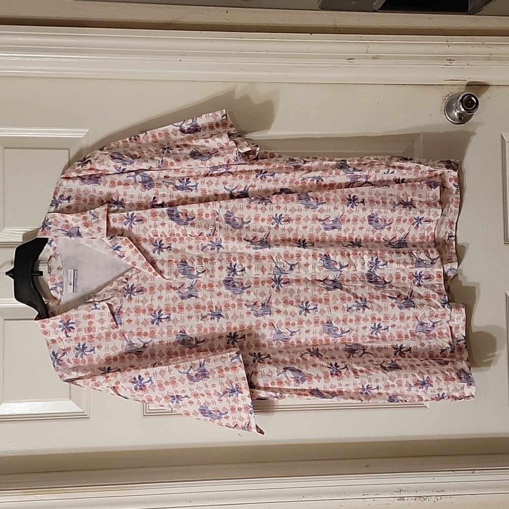 Columbia fishing shirt has palm trees and fish.